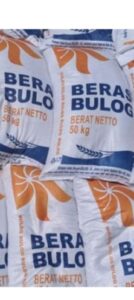 Mbminvestigasi.com | Bantuan Beras Bulog di Desa Sukajaya Belum Dibagikan, Warga Menunggu Enam Hari — Camat: Harus Segera Disalurkan; Ketua BPD Heran Beras Langsung ke Rumah Kades